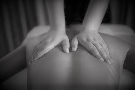 hands on back giving a massage